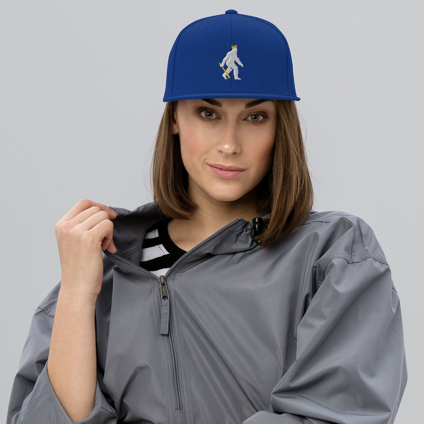 KC Swag Kansas City Royals Blue Crowned Pasquatch Flat Snapback Hat worn by female model