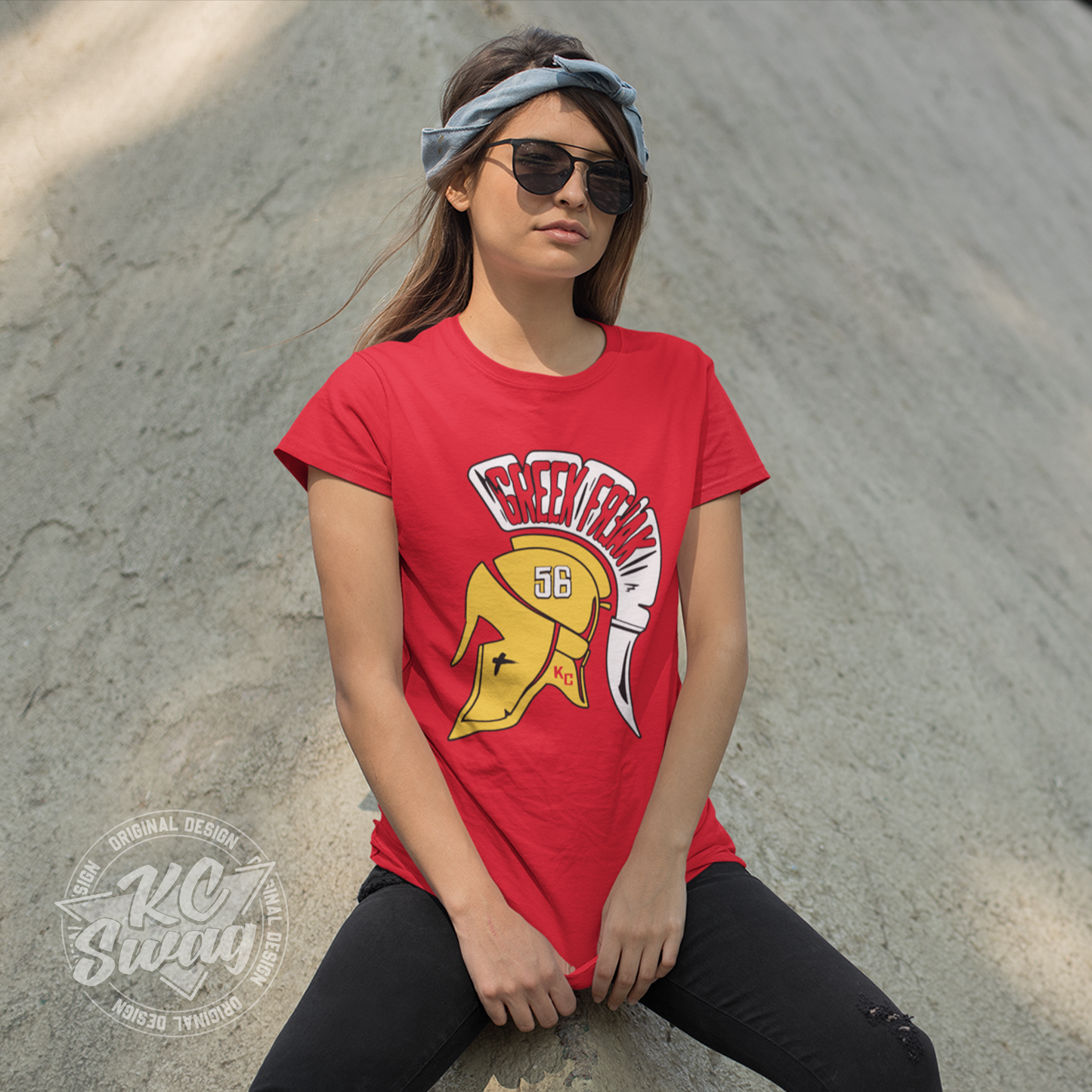 KC Swag - Kansas City Chiefs FEAR THE GREEK FREAK KARLAFTIS on red unisex t-shirt worn by female model wearing sunglasses and leaning on concrete wall