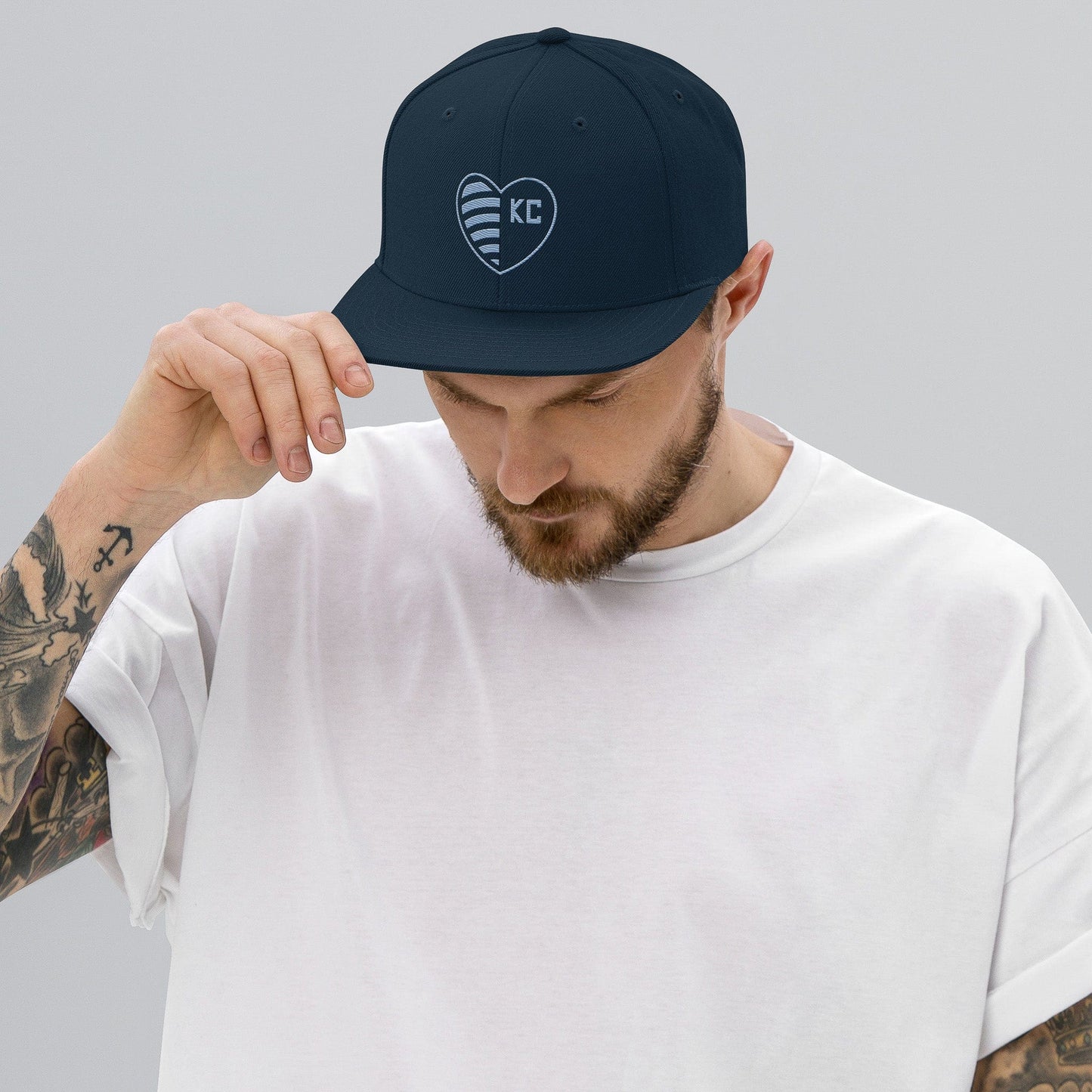 KC Swag Sporting Kansas City Navy Striped Heart Flat Snapback Hat worn by male model