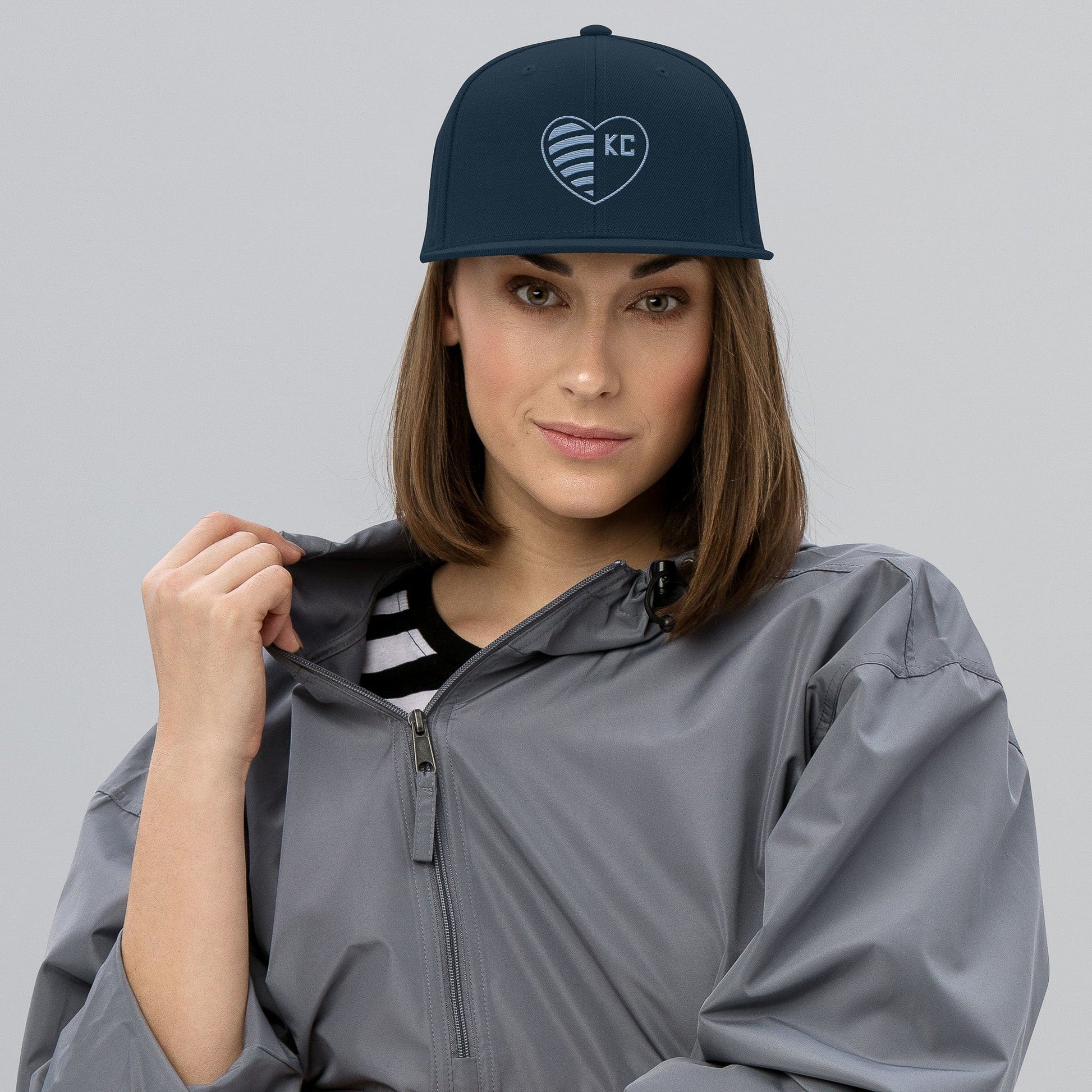 KC Swag Sporting Kansas City Navy Striped Heart Flat Snapback Hat worn by female model