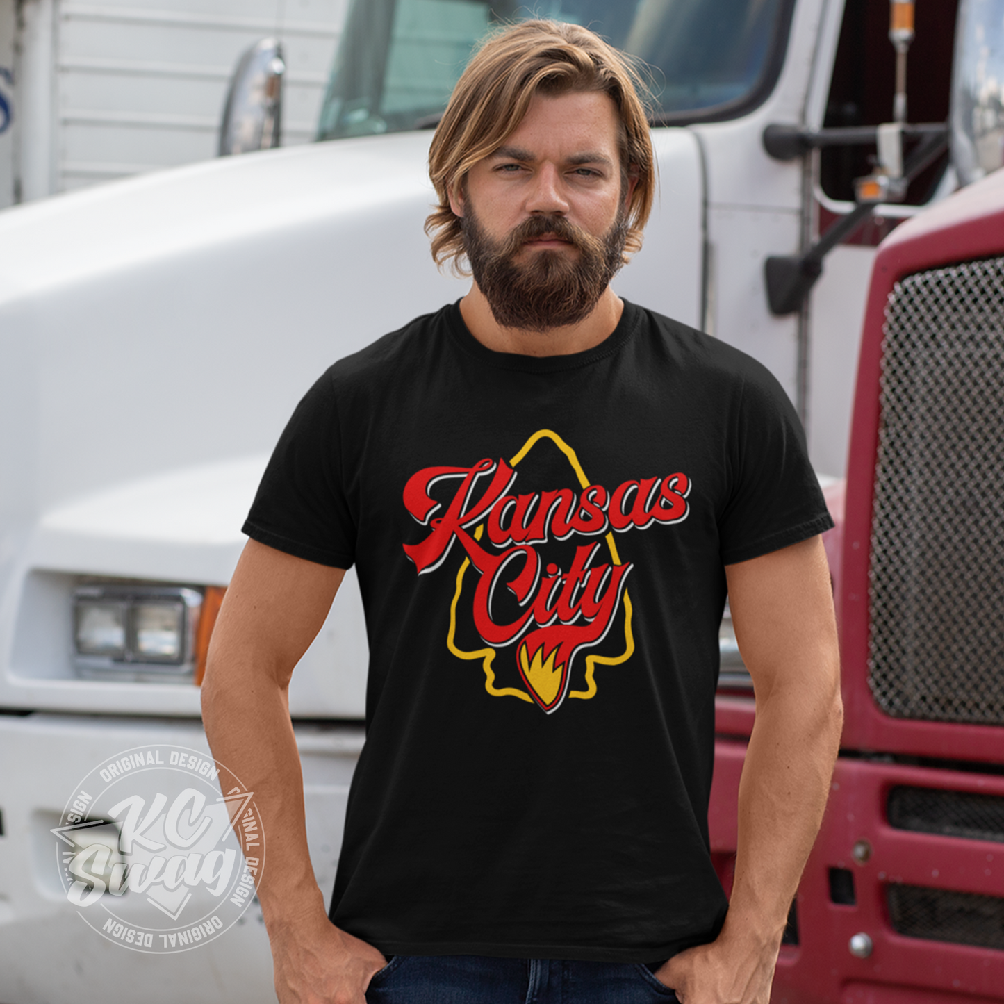 KC Swag - Kansas City Chiefs KANSAS CITY WOLF TAIL ARROWHEAD on black unisex t-shirt male model standing in front of semi truck cabs