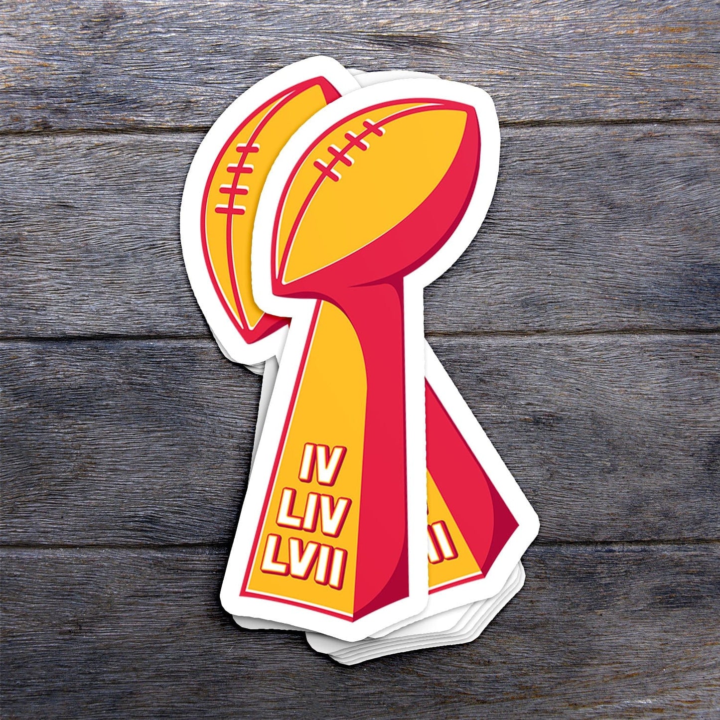 KC Swag Kansas City Chiefs red, yellow LOMBARDI SBx3 vinyl die cut decal sticker stack on dark wood table