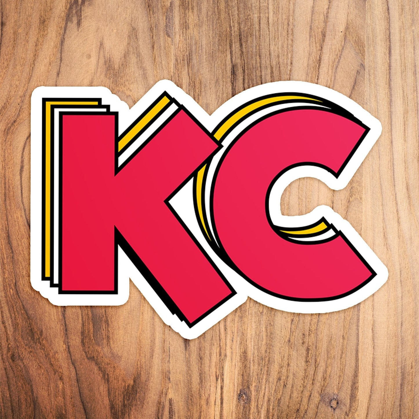 KC Swag Kansas City Chiefs red, yellow STACKED RED KC vinyl die cut decal sticker on wood table