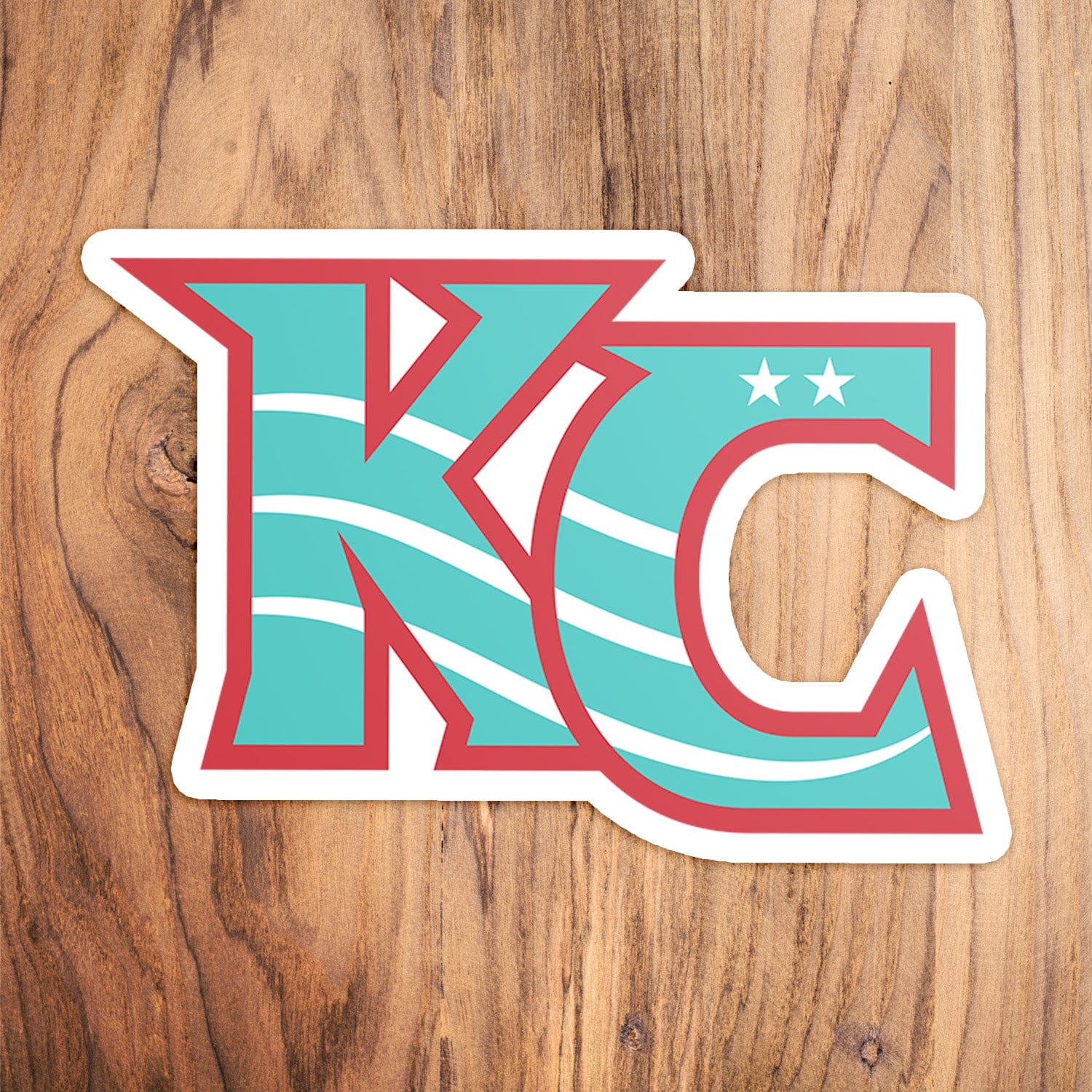 KC Swag Kansas City Current CURRENT KC die-cut sticker decal made from waterproof vinyl on wood table