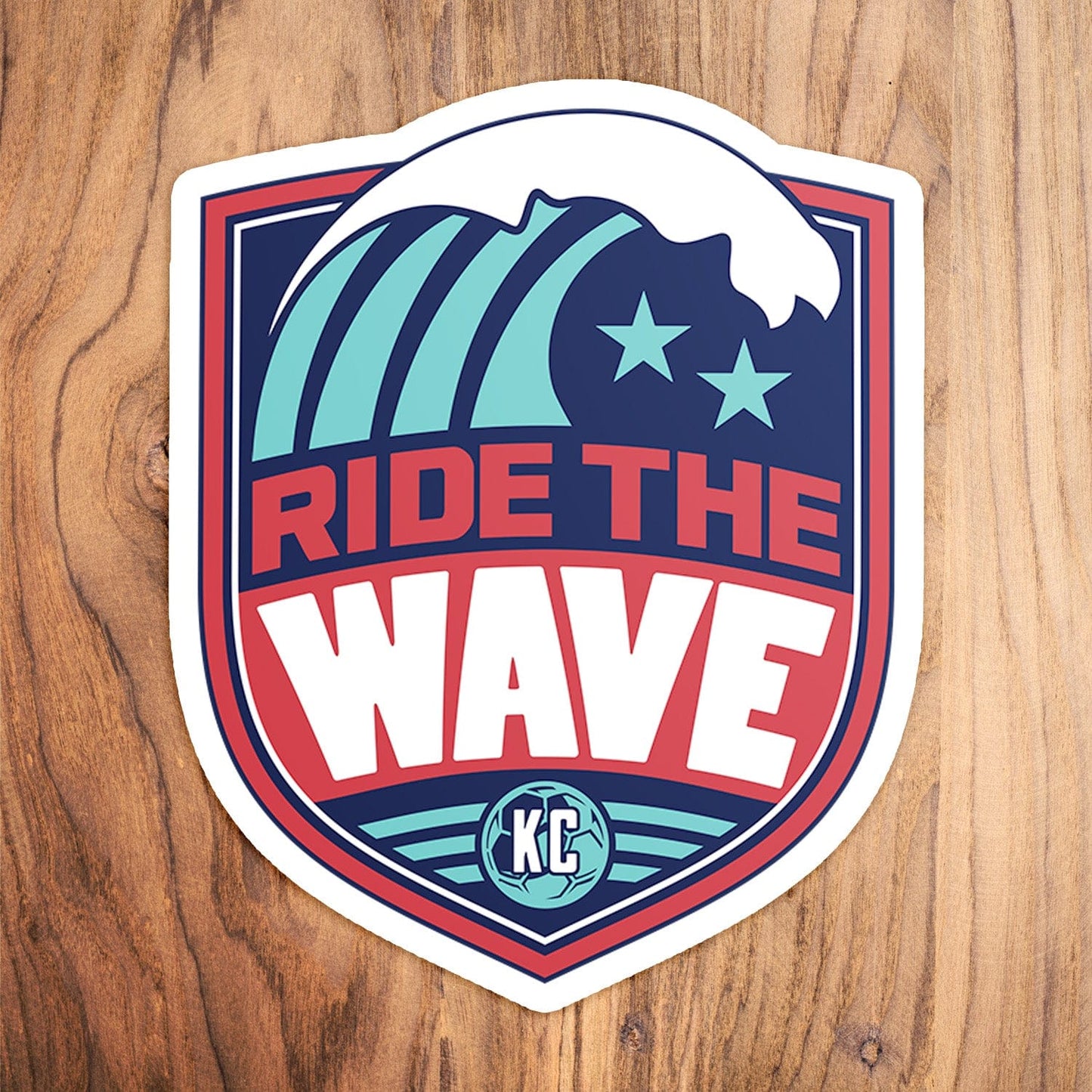 KC Swag Kansas City Current RIDE THE WAVE die-cut sticker decal made from waterproof vinyl on wood table
