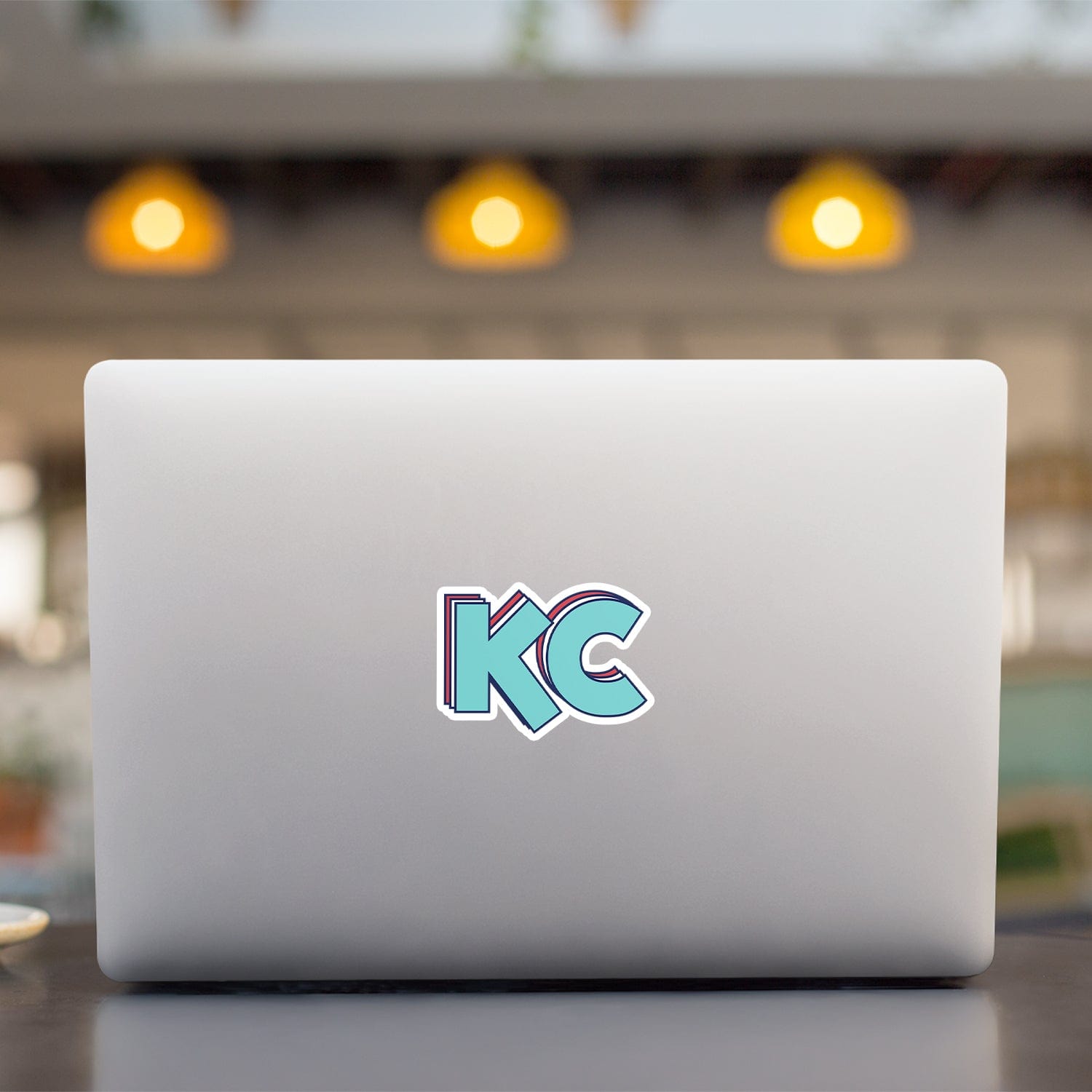 KC Swag Kansas City Current STACKED TEAL KC die-cut sticker decal made from waterproof vinyl on open laptop back
