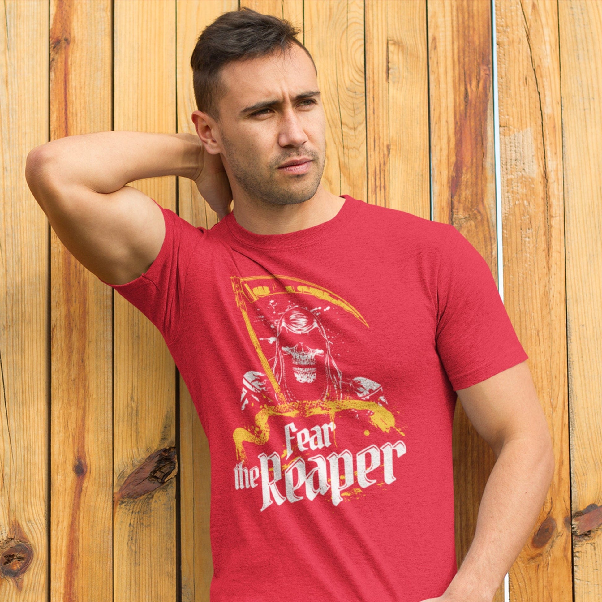KC Swag Kansas City Chiefs COOL WOLF KINGDOM with wolf face graphic on heather red t-shirt worn by male model against wood fence