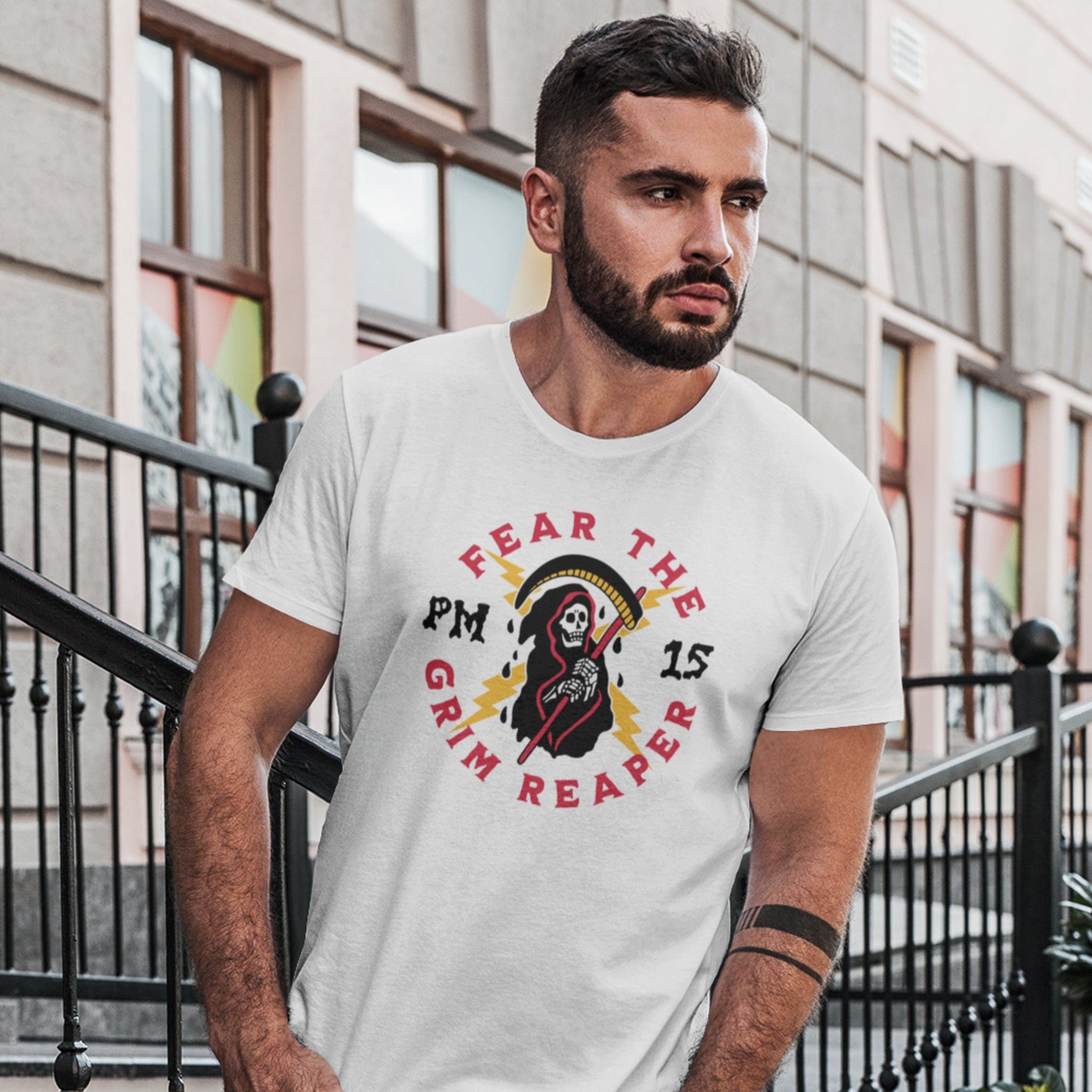 KC Swag Kansas City Chiefs GRIM REAPER PM15 on white t-shirt worn by male model in front of urban townhomes