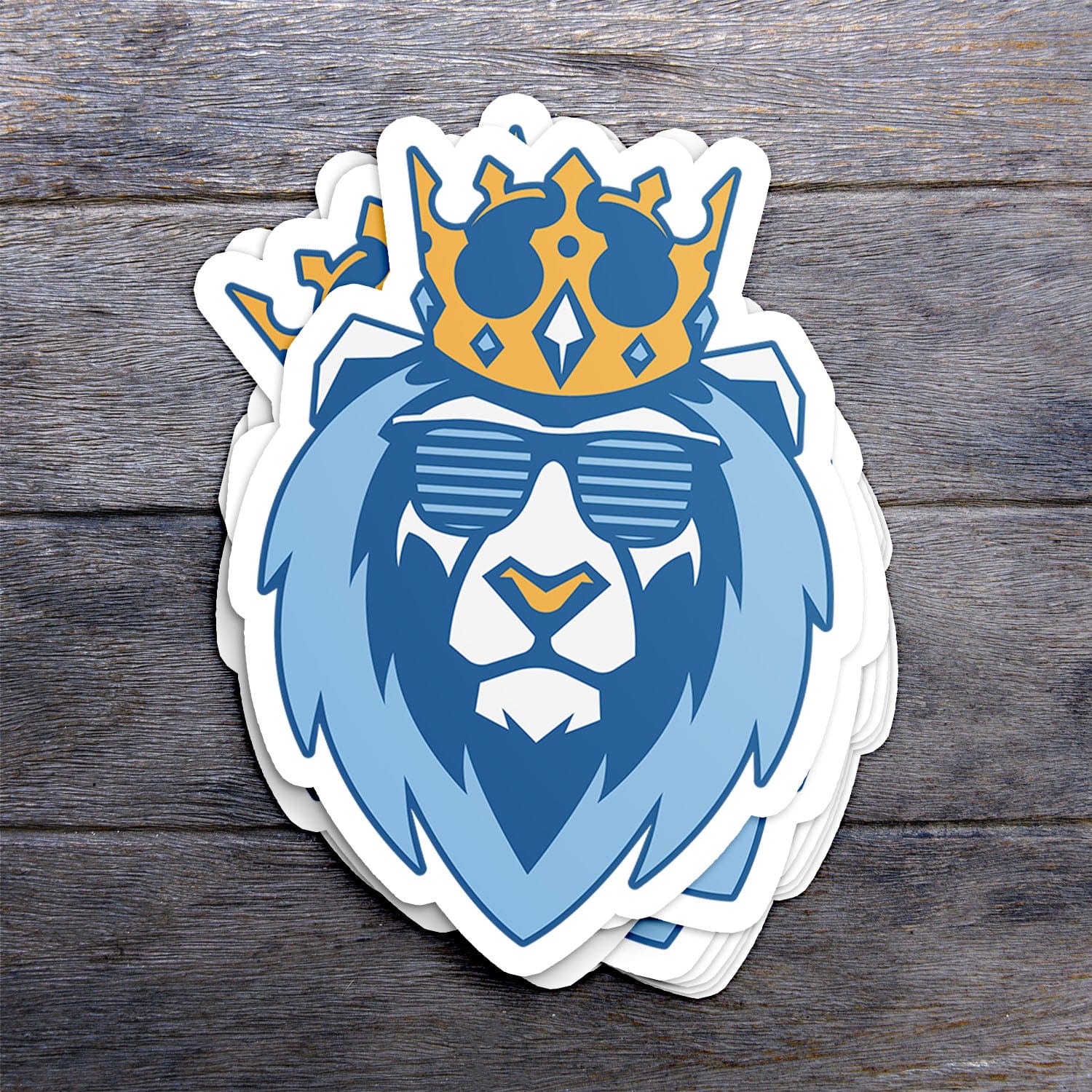 KC Swag Kansas City Royals blue, gold, powder blue SHADY LION vinyl die cut sticker stack on dark wood table