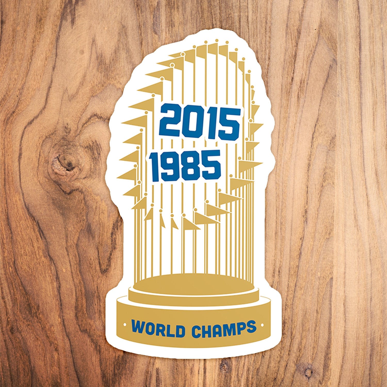 KC Swag Kansas City Royals gold, blue World Series Champs vinyl die cut decal sticker on wood table