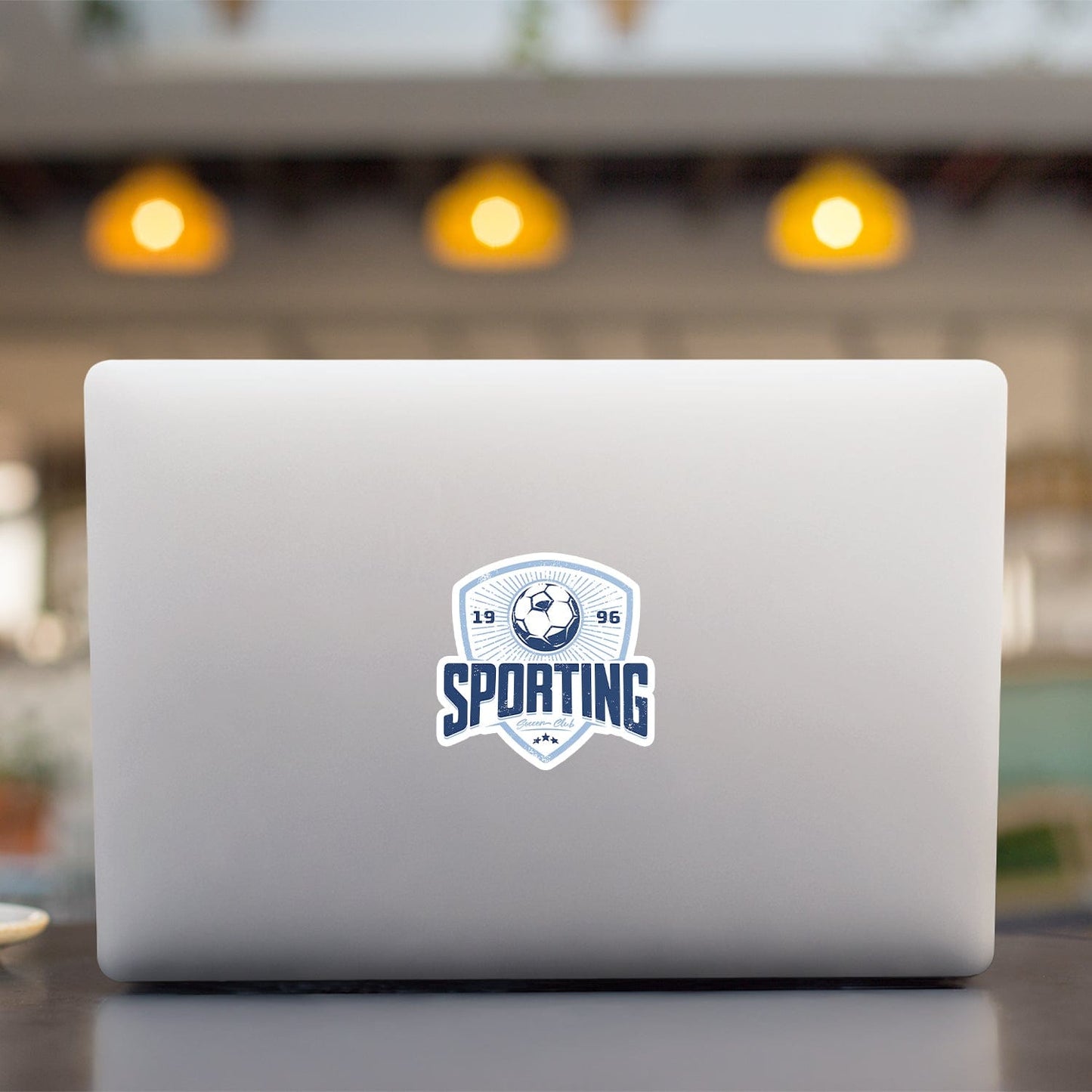 KC Swag Sporting Kansas City powder, navy Sporting Club vinyl die cut decal sticker on open laptop back
