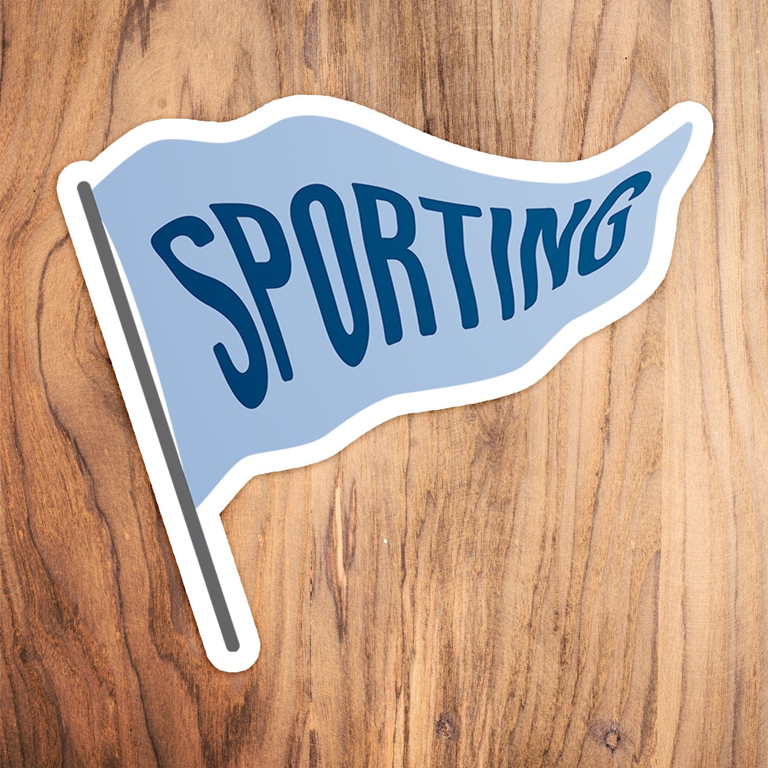 KC Swag Sporting Kansas City powder, navy, grey Sporting Pennant vinyl die cut decal sticker on wood table