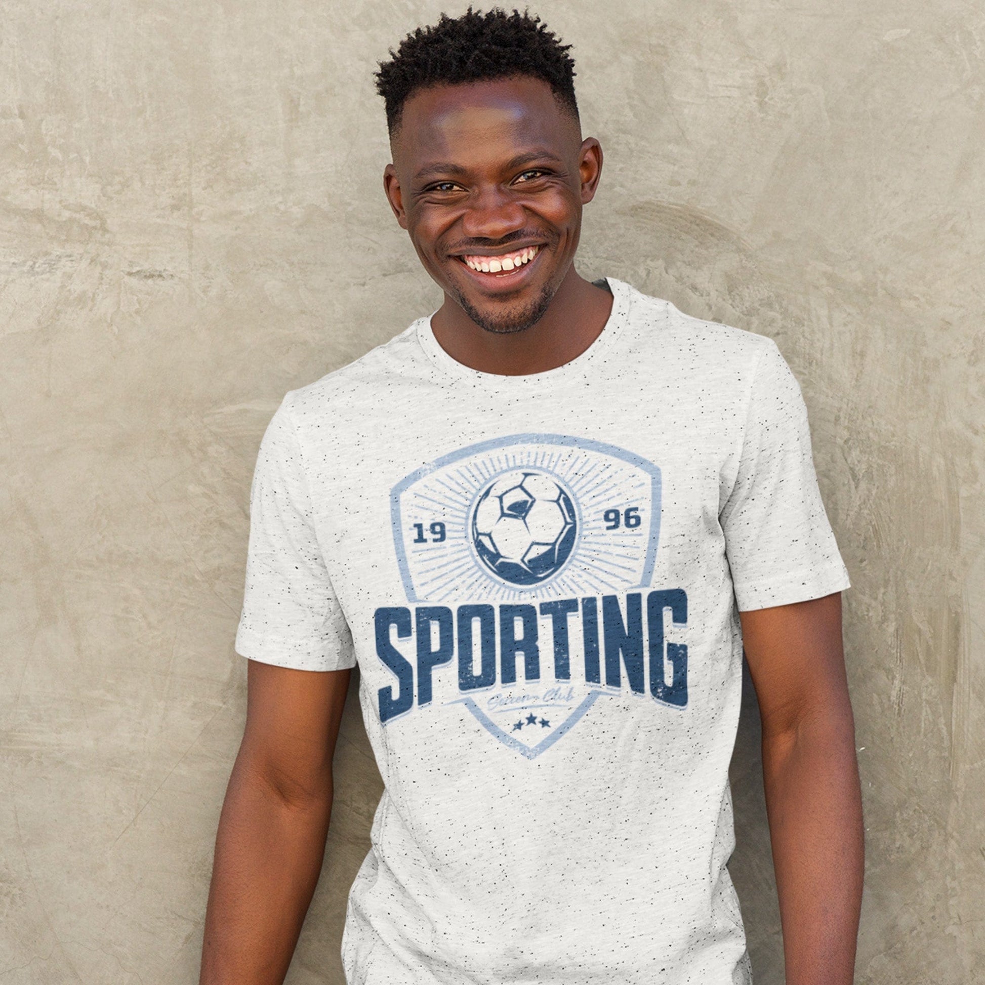 KC Swag Sporting Kansas City navy, powder, white SPORTING CLUB on heather ash unisex t-shirt worn by male model standing in front of concrete wall